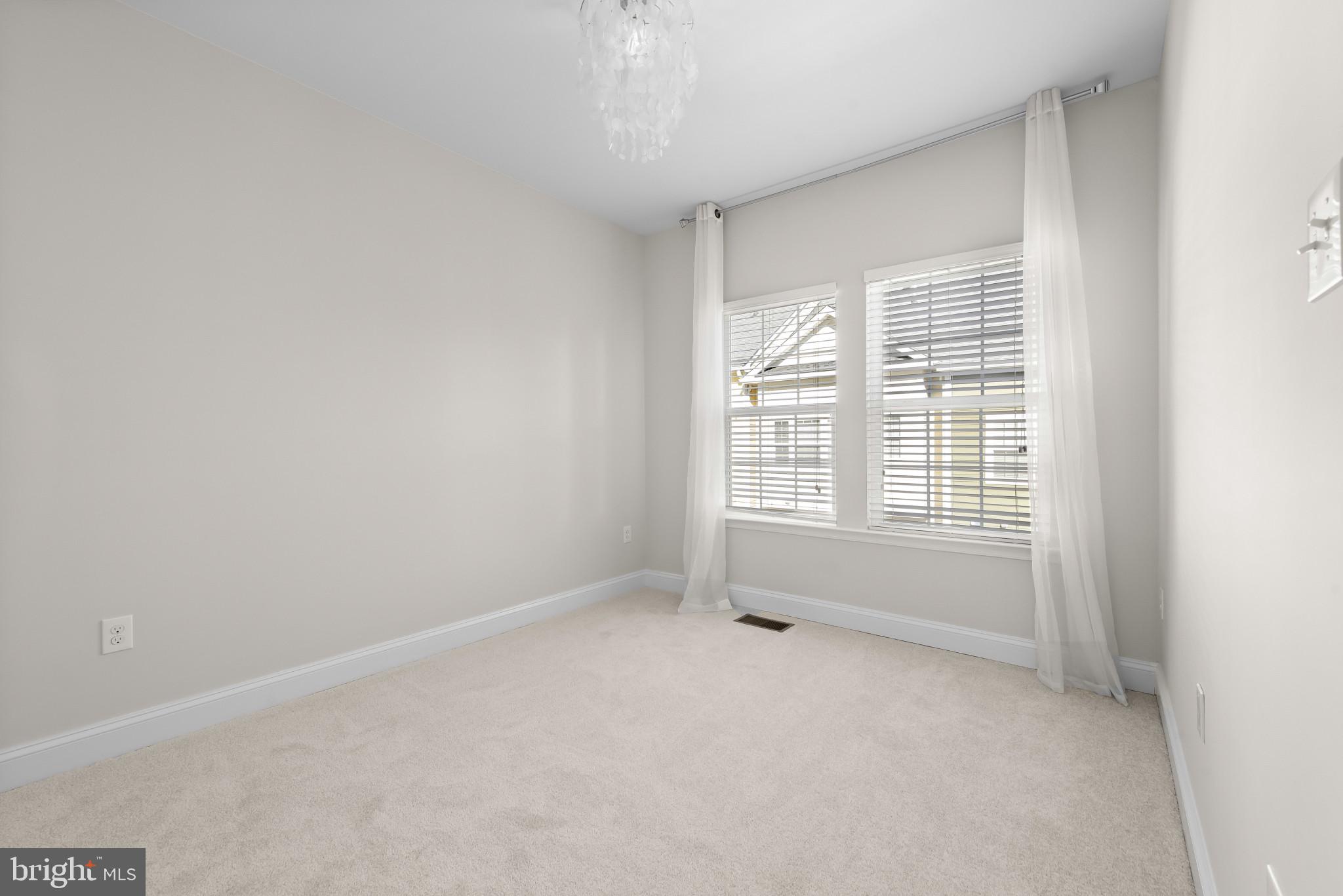 5948 Logans Way Ellicott City, MD 21043 - Photo 37 of 44 an empty room with windows