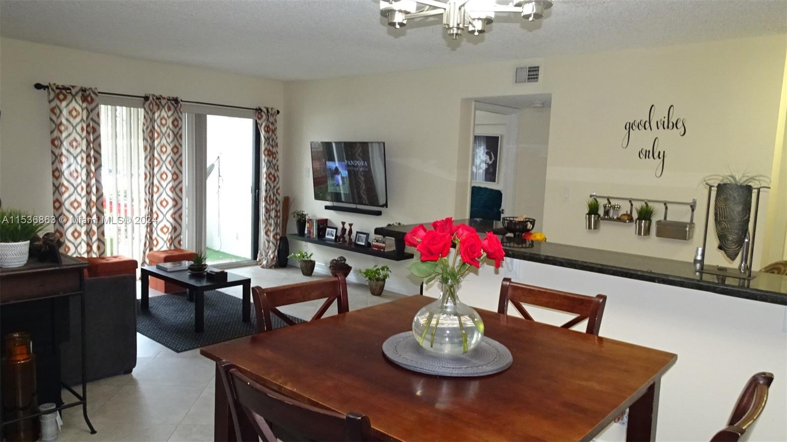 650 South Park Road, Unit 135 Hollywood, FL 33021 - Photo 13 of 36 a view of a dining room with furniture window and wooden floor