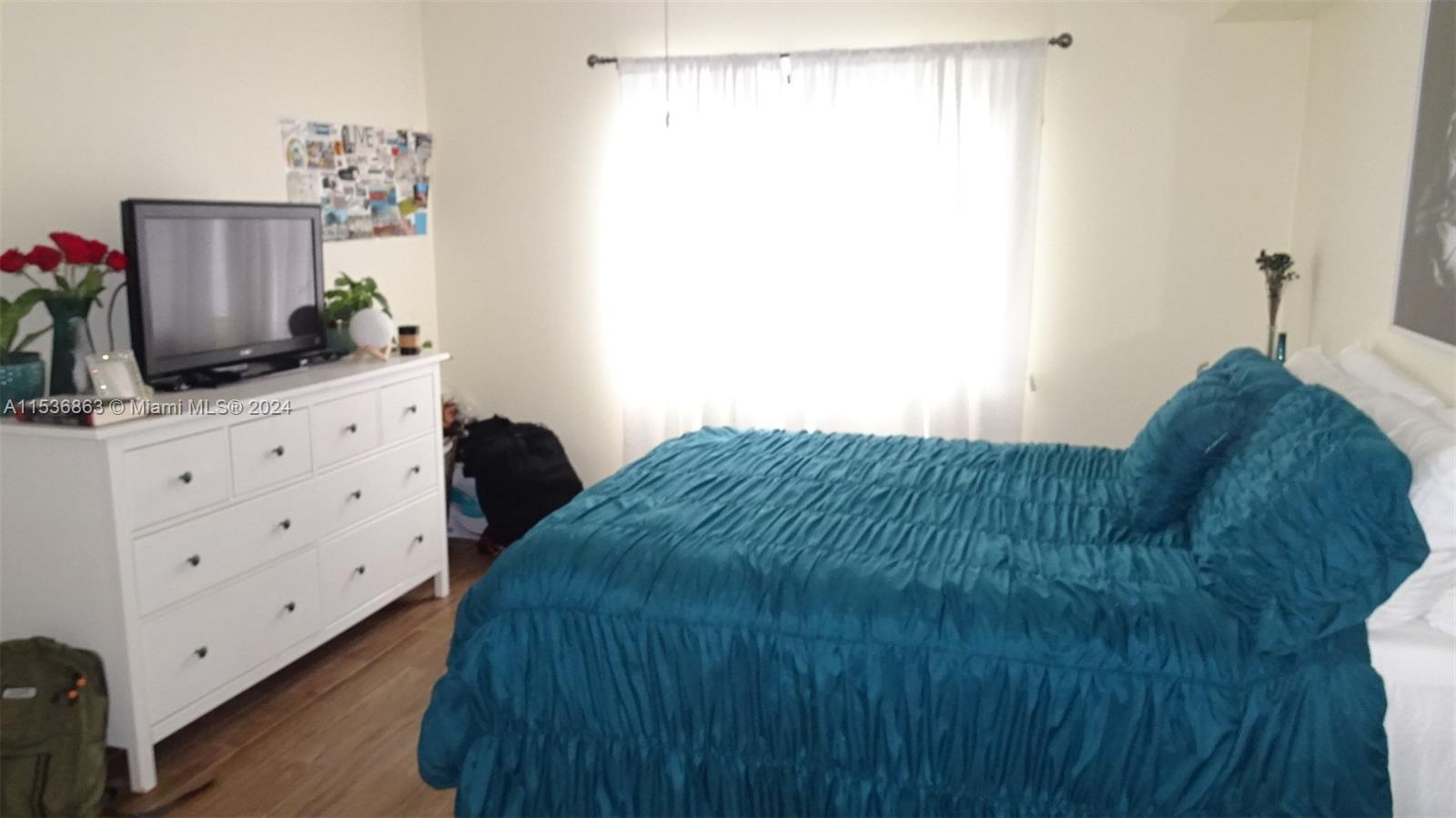 650 South Park Road, Unit 135 Hollywood, FL 33021 - Photo 16 of 36 a bedroom with a bed and a dresser in it