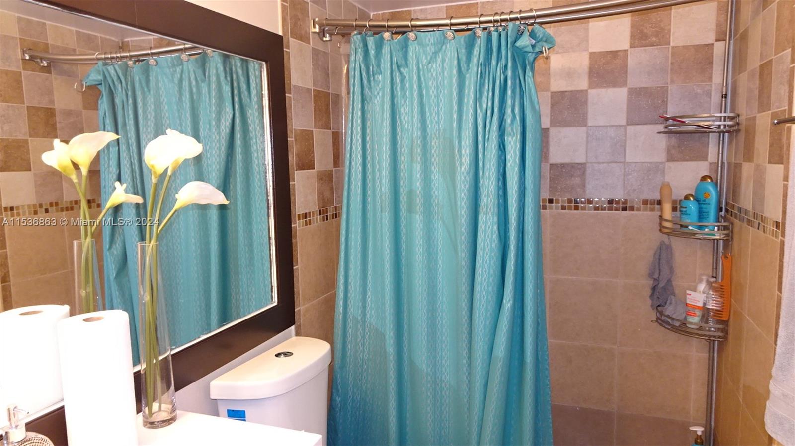 650 South Park Road, Unit 135 Hollywood, FL 33021 - Photo 17 of 36 a bathroom with a shower toilet and sink