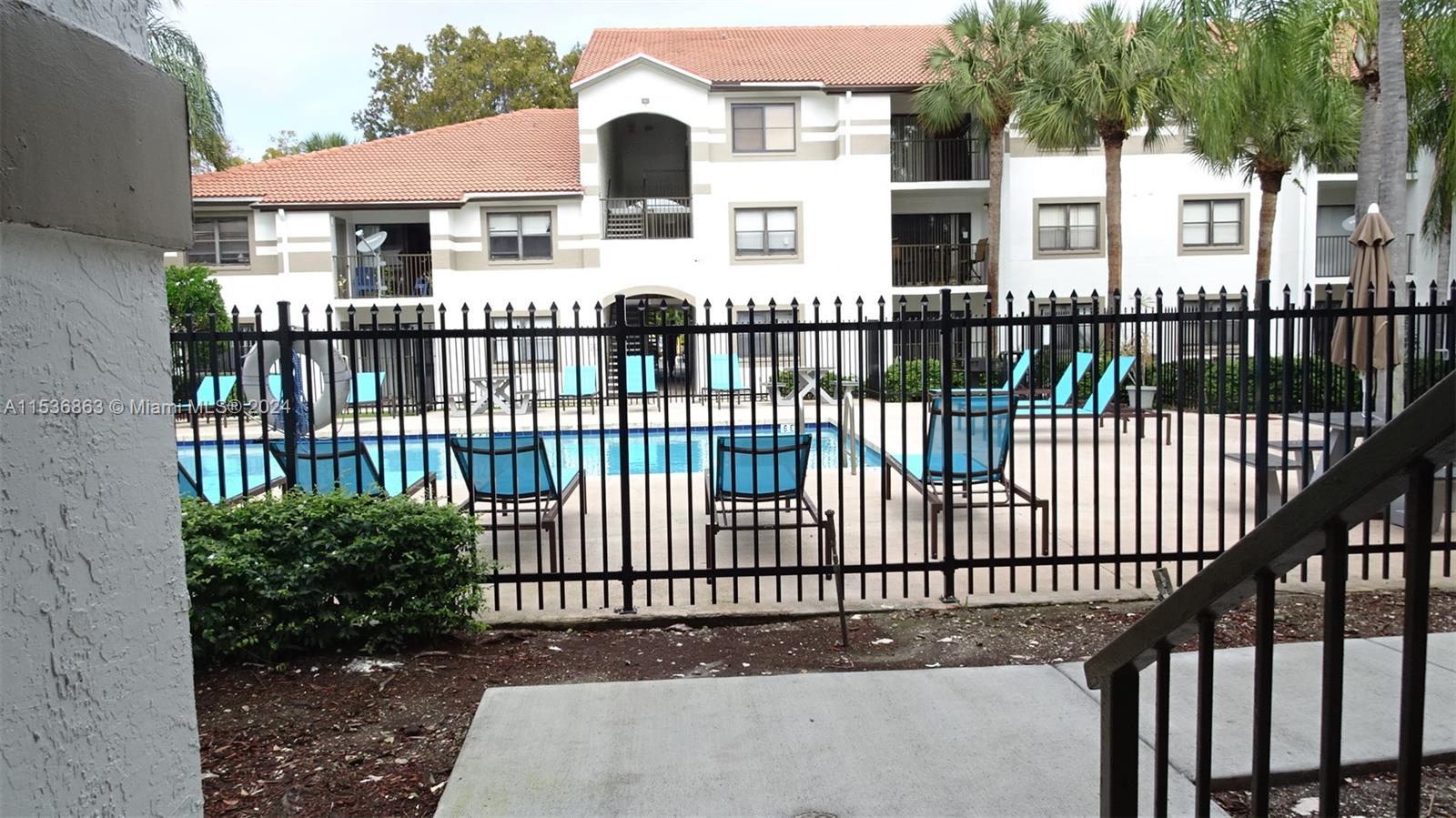 650 South Park Road, Unit 135 Hollywood, FL 33021 - Photo 26 of 36 a front view of a house with a iron gate