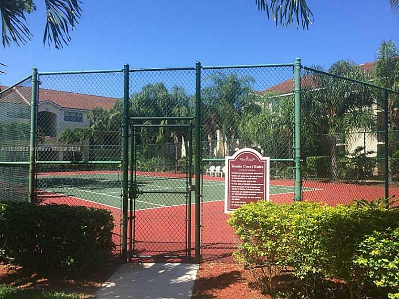 650 South Park Road, Unit 135 Hollywood, FL 33021 - Photo 30 of 36 a garden view with a swimming pool