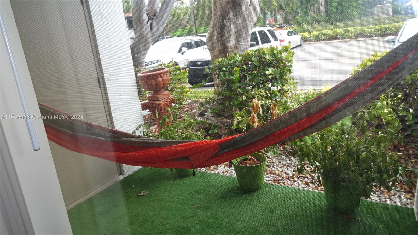 650 South Park Road, Unit 135 Hollywood, FL 33021 - Photo 9 of 36 a view of a yard with a wooden fence