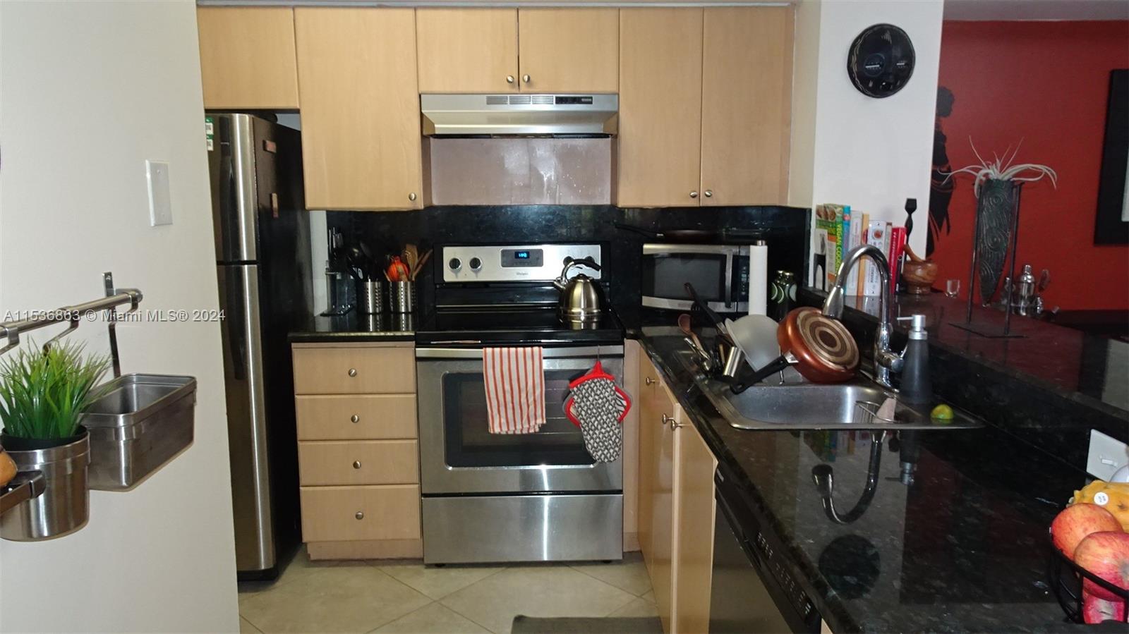 650 South Park Road, Unit 135 Hollywood, FL 33021 - Photo 10 of 36 a kitchen with a sink appliances and cabinets