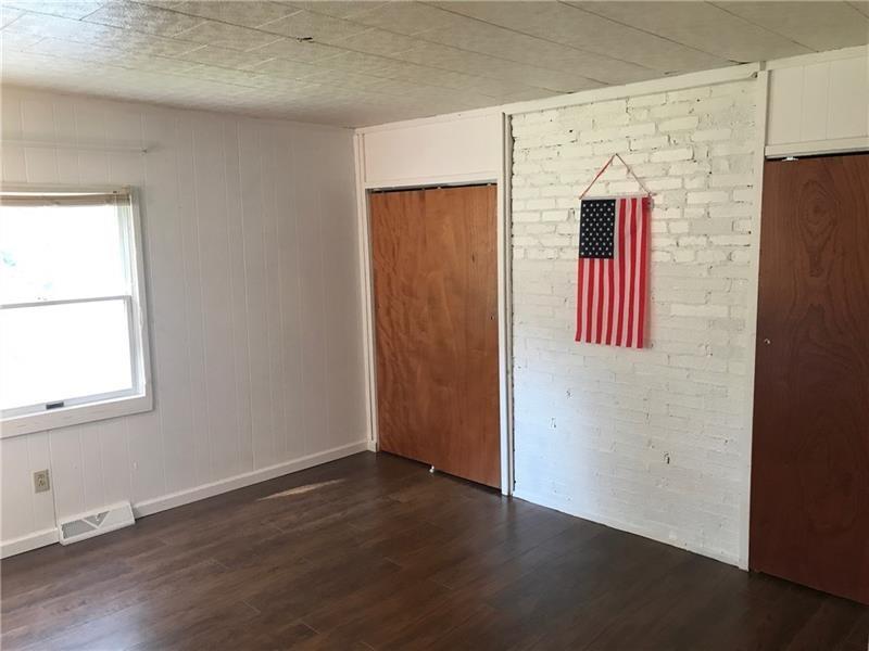 1102 Grant Street Bulger, PA 15019 - Photo 12 of 25 an empty room with wooden floor and windows
