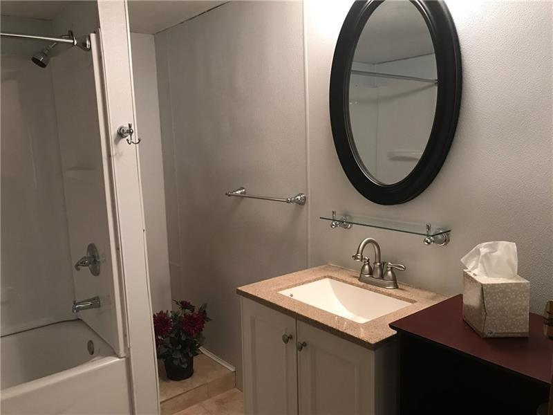 1102 Grant Street Bulger, PA 15019 - Photo 15 of 25 a bathroom with a sink and a mirror