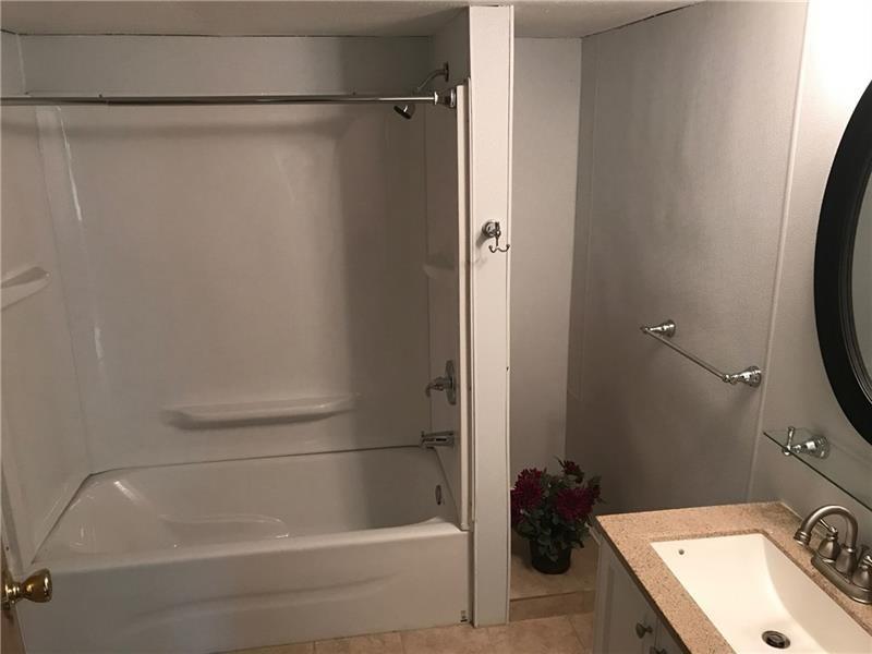 1102 Grant Street Bulger, PA 15019 - Photo 16 of 25 a bathroom with a tub and a sink