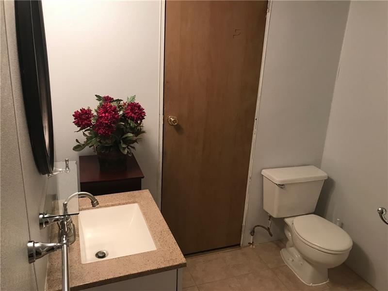 1102 Grant Street Bulger, PA 15019 - Photo 17 of 25 a bathroom with a toilet sink and mirror