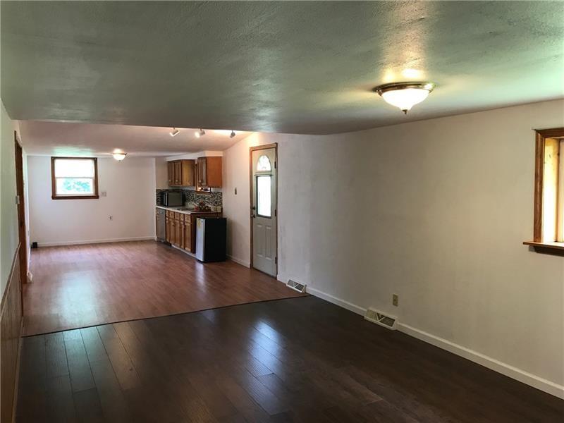 1102 Grant Street Bulger, PA 15019 - Photo 18 of 25 an empty room with windows and entrance