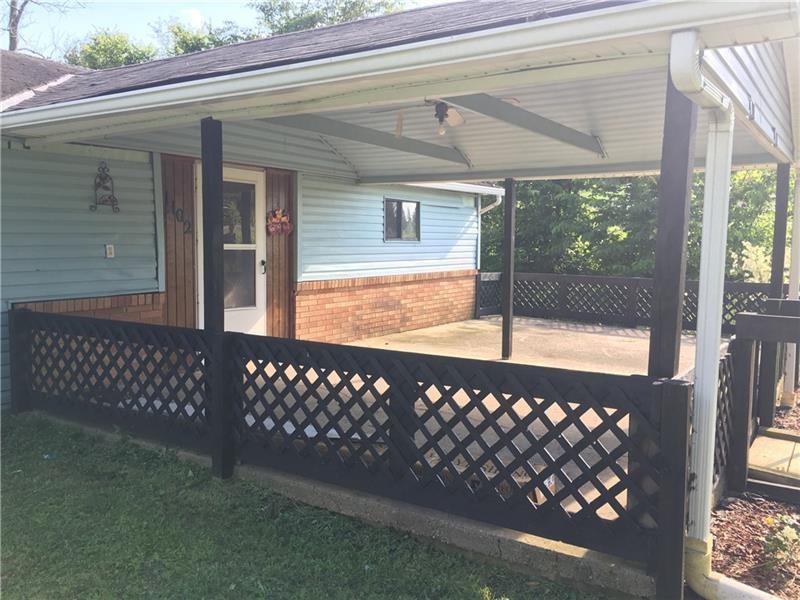1102 Grant Street Bulger, PA 15019 - Photo 2 of 25 a view of a black gate