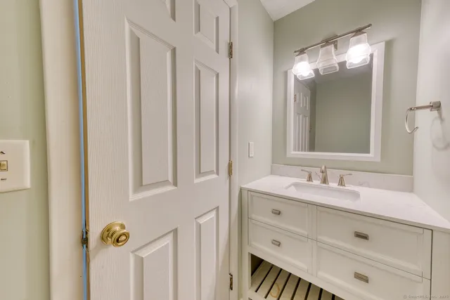 a bathroom with a double vanity sink and mirror