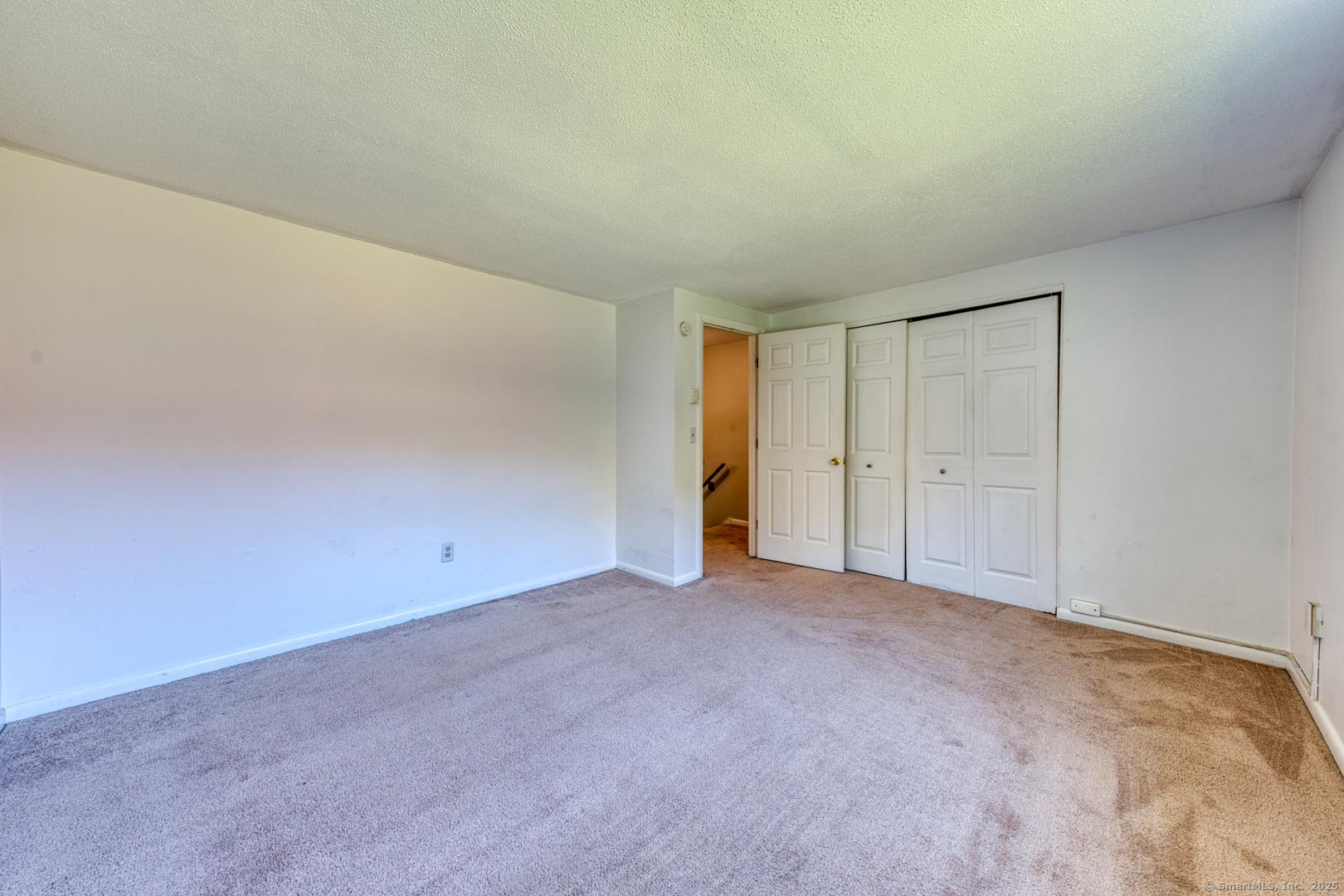 12 Stone Pond Road, Unit 12 Tolland, CT 06084 - Photo 17 of 31 a view of an empty room and closet area