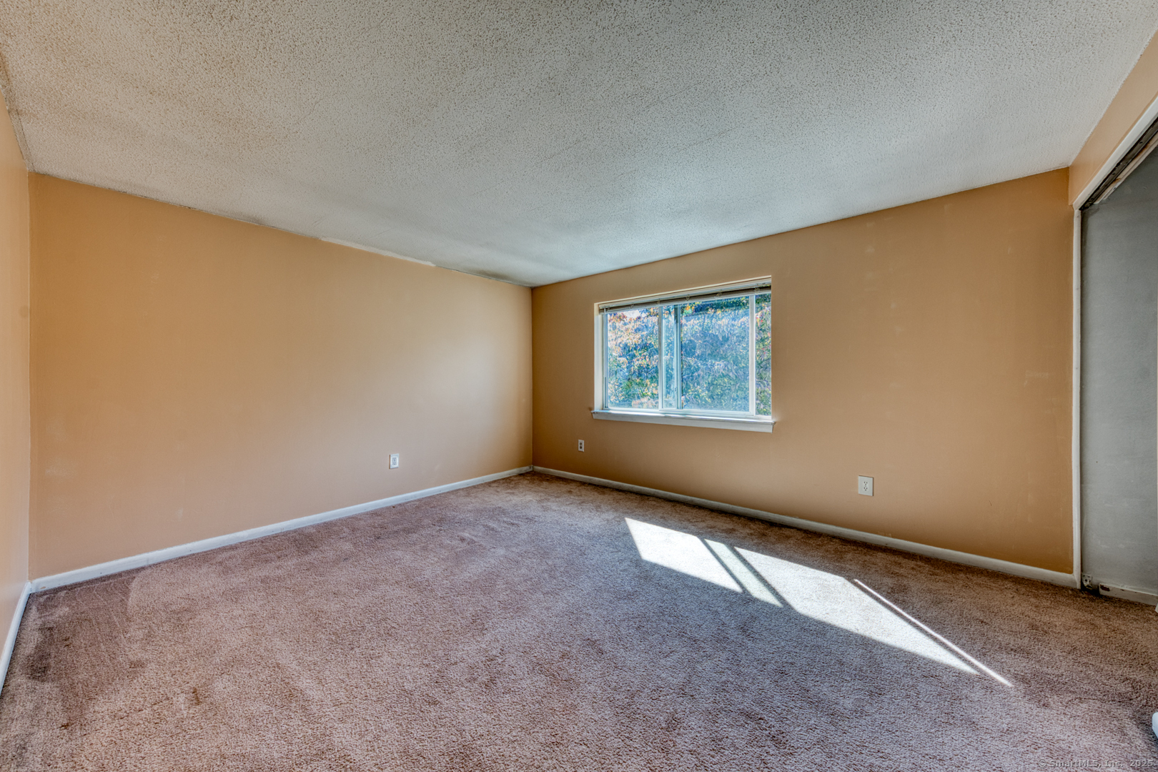 12 Stone Pond Road, Unit 12 Tolland, CT 06084 - Photo 18 of 31 an empty room with windows