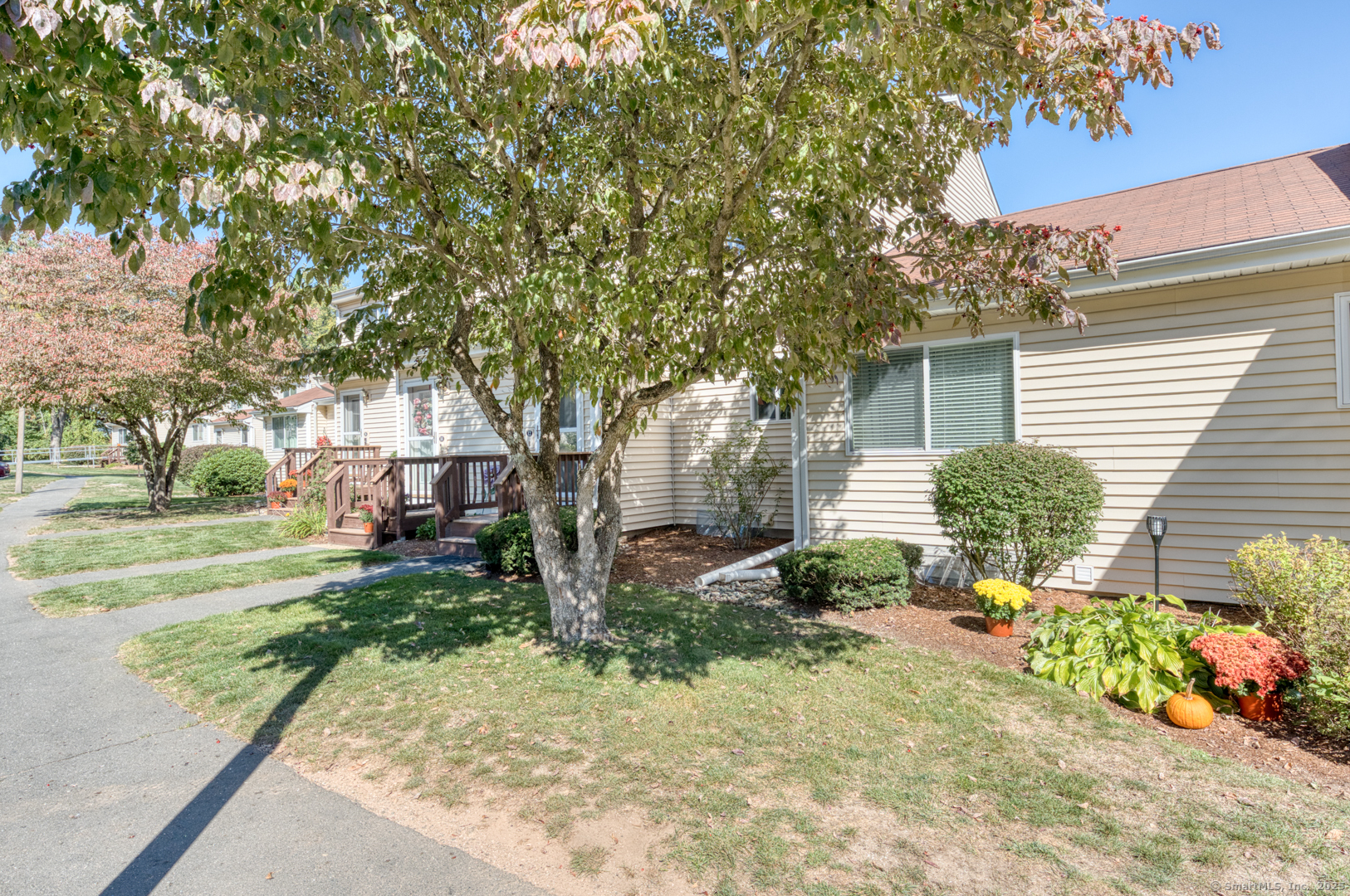 12 Stone Pond Road, Unit 12 Tolland, CT 06084 - Photo 2 of 31 a view of a house with a yard and pathway