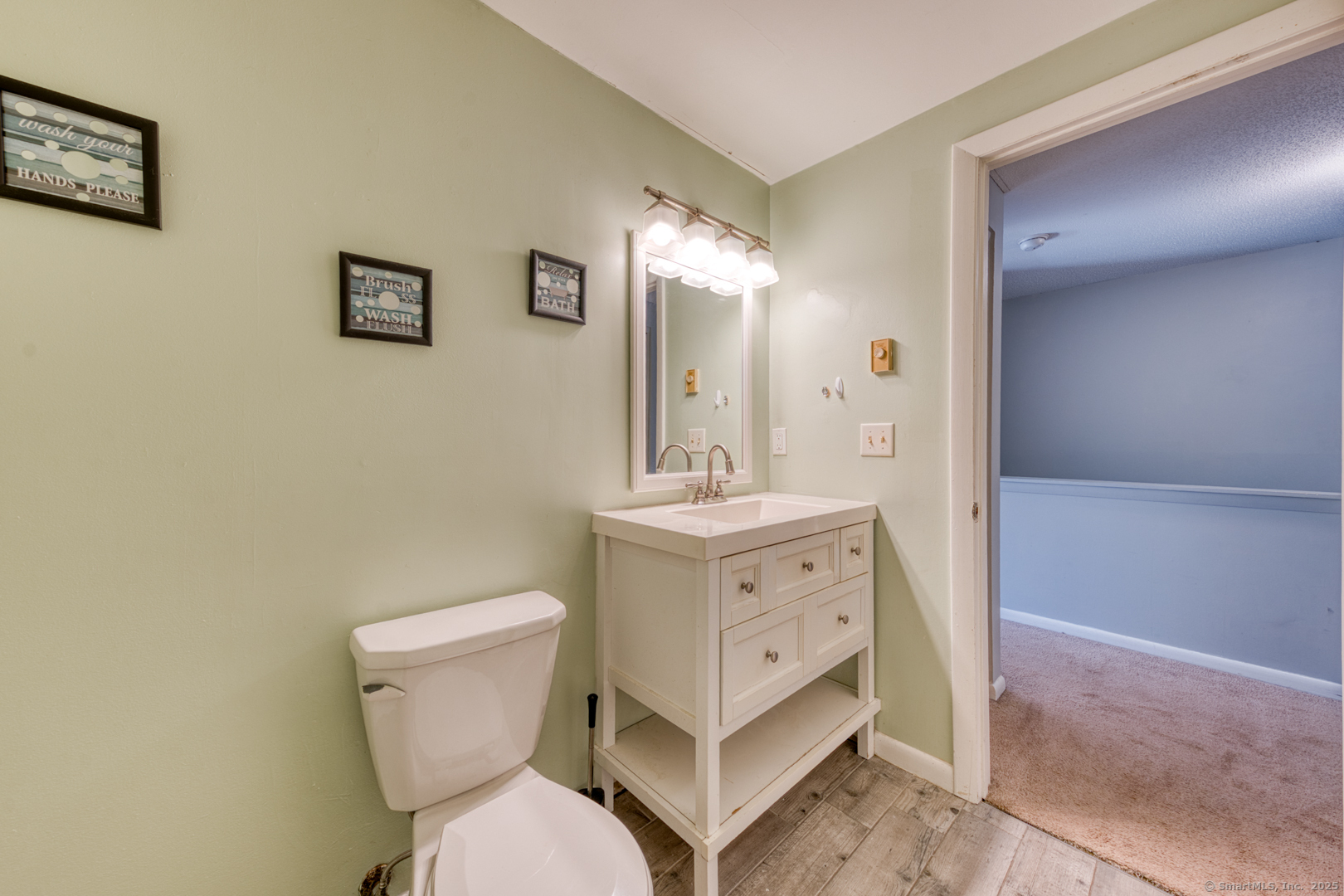 12 Stone Pond Road, Unit 12 Tolland, CT 06084 - Photo 21 of 31 a bathroom with a toilet sink and mirror