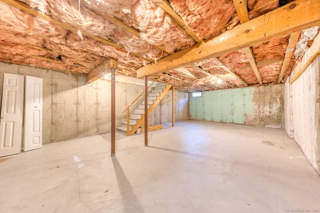 a view of a room with wooden walls