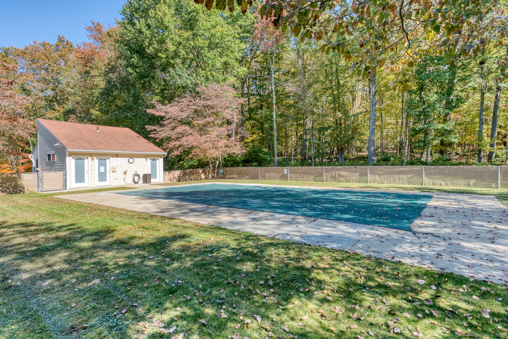 12 Stone Pond Road, Unit 12 Tolland, CT 06084 - Photo 30 of 31 a house with trees in the background