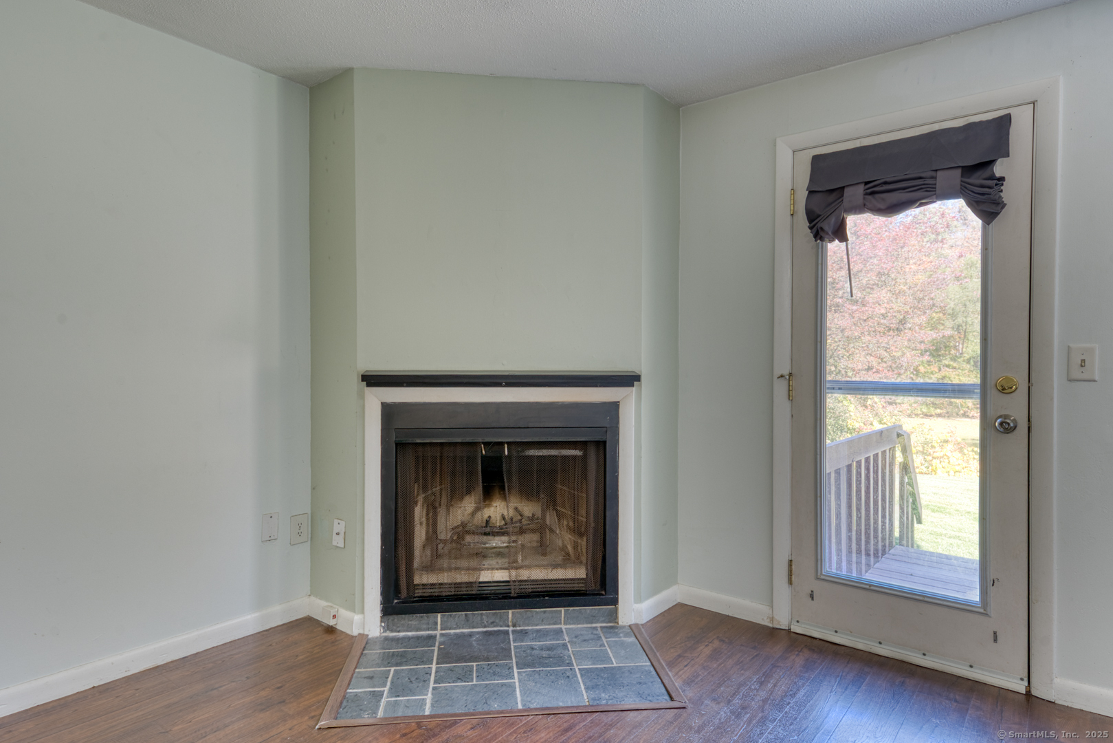12 Stone Pond Road, Unit 12 Tolland, CT 06084 - Photo 5 of 31 a view of an empty room with wooden floor and a window