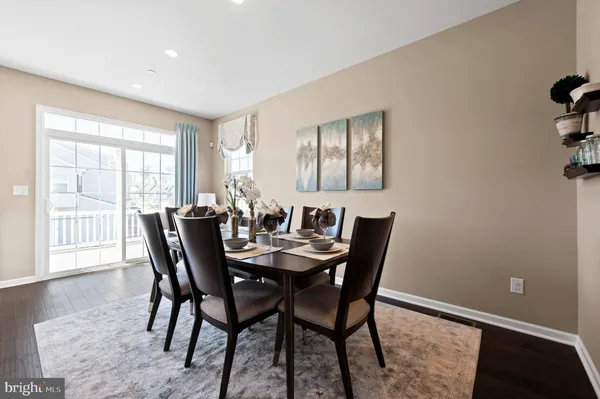 a view of a dining room with furniture and window