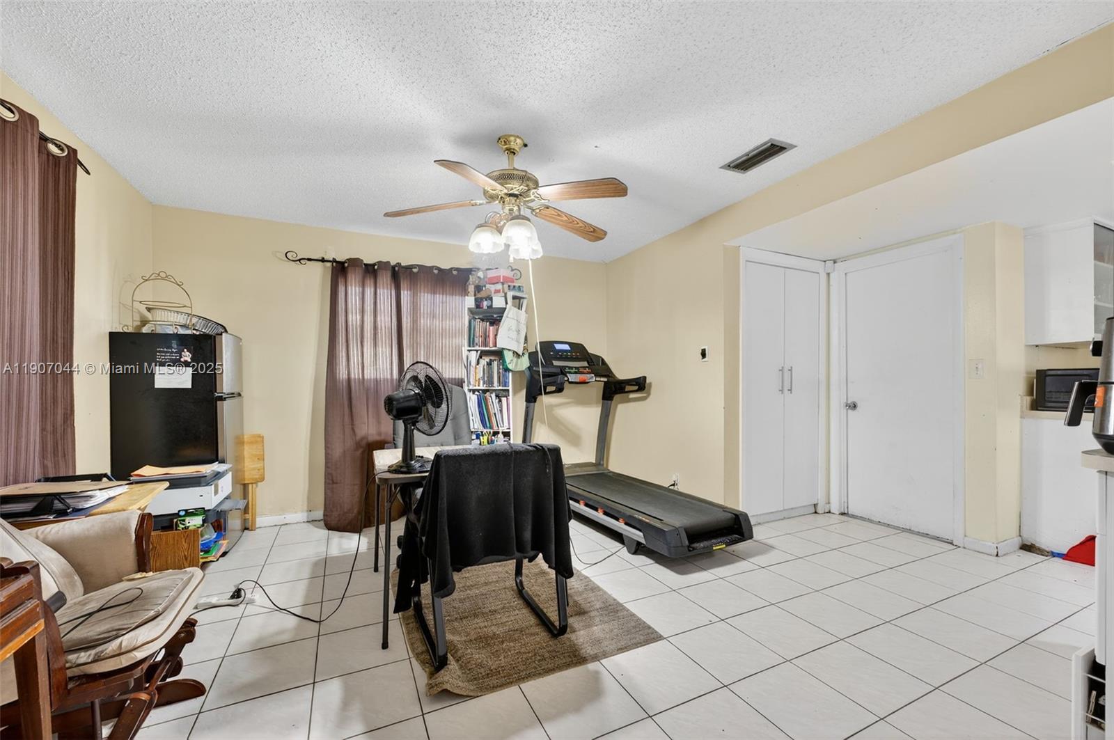 849 Northwest 70th Way Margate, FL 33063 - Photo 15 of 29 a view of a room with gym equipment