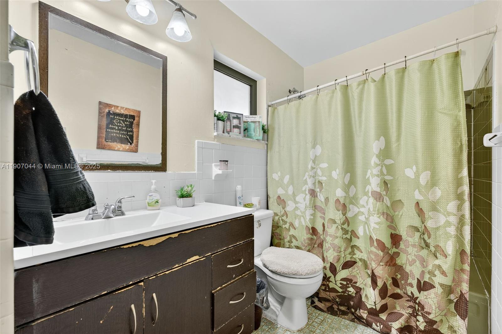 849 Northwest 70th Way Margate, FL 33063 - Photo 19 of 29 a bathroom with a sink a toilet and shower