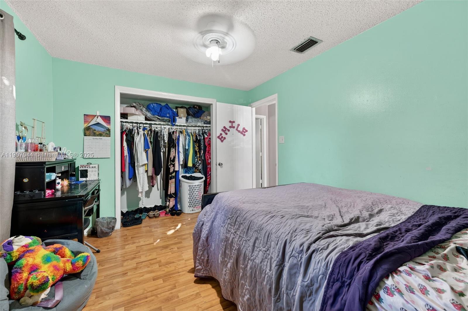 849 Northwest 70th Way Margate, FL 33063 - Photo 20 of 29 a bedroom with a bed closet and bedroom