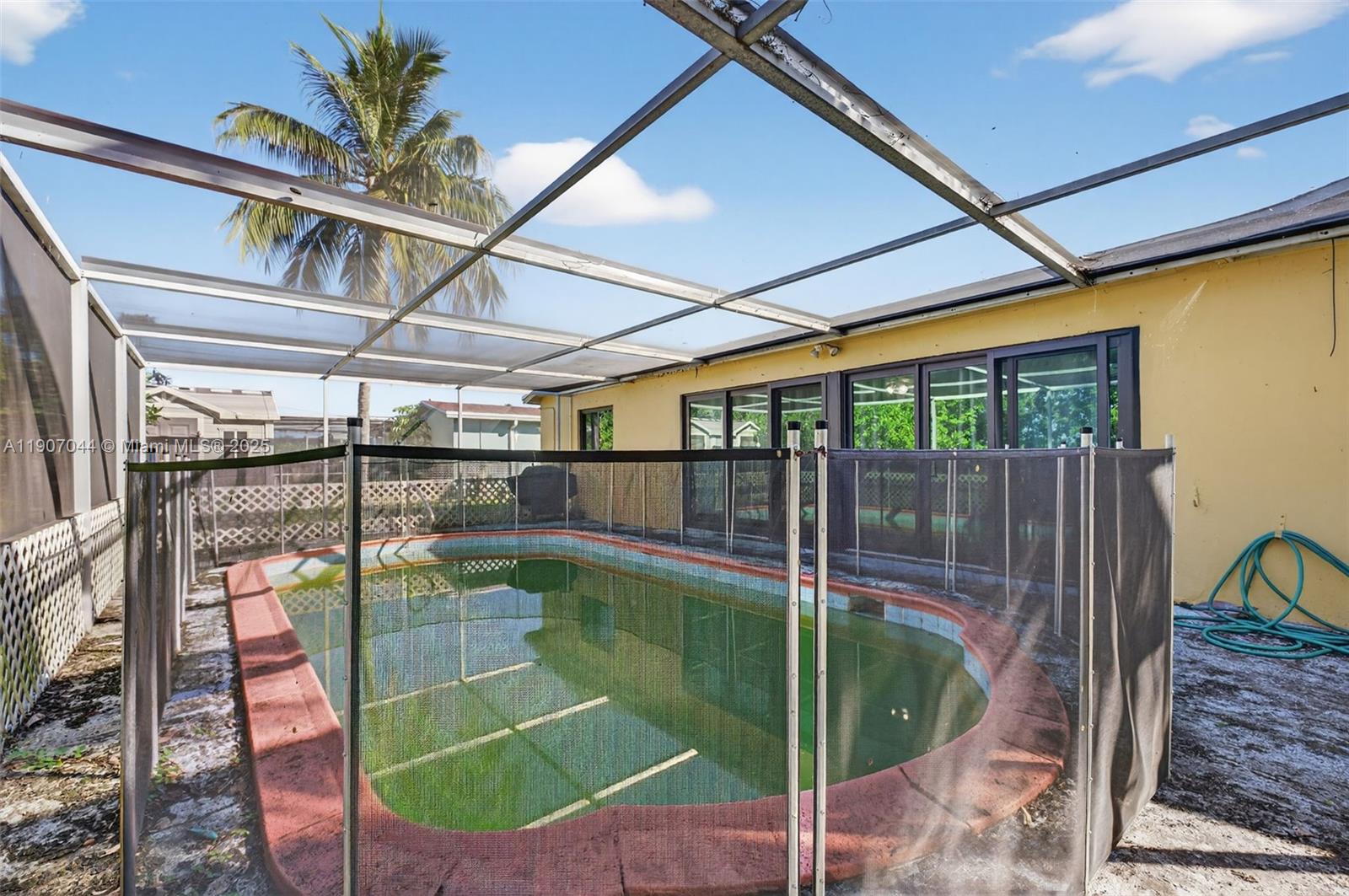 849 Northwest 70th Way Margate, FL 33063 - Photo 24 of 29 a swimming pool with a glass door and glass door