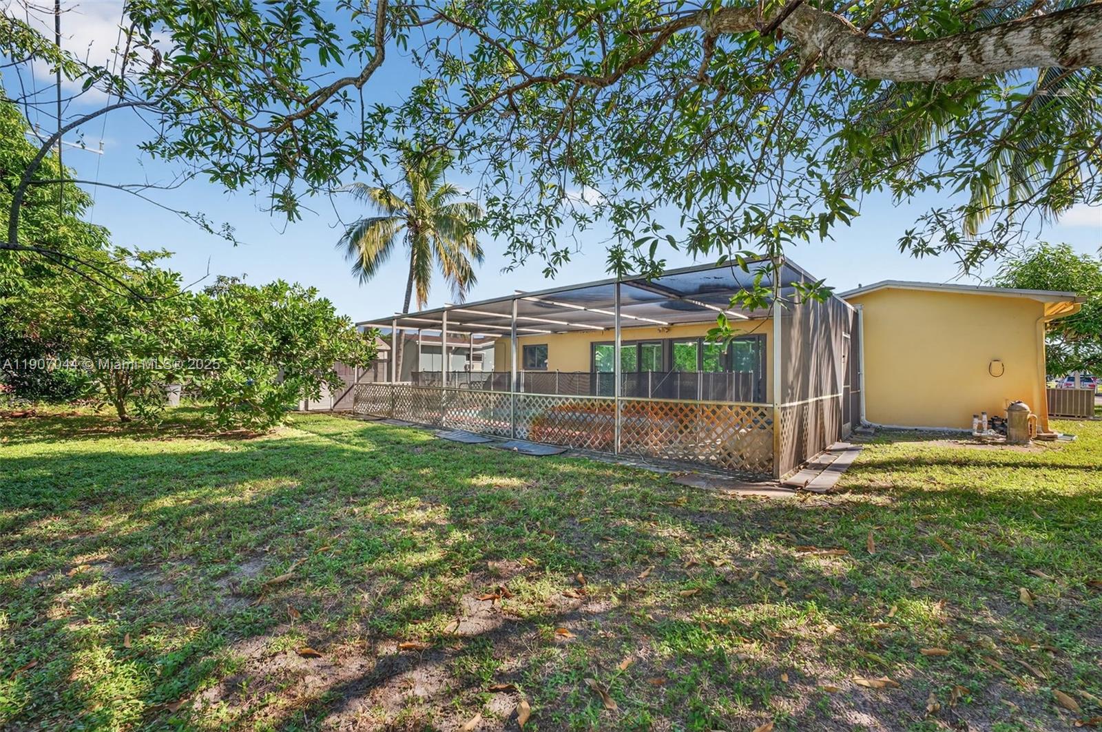 849 Northwest 70th Way Margate, FL 33063 - Photo 26 of 29 a view of a house with a yard