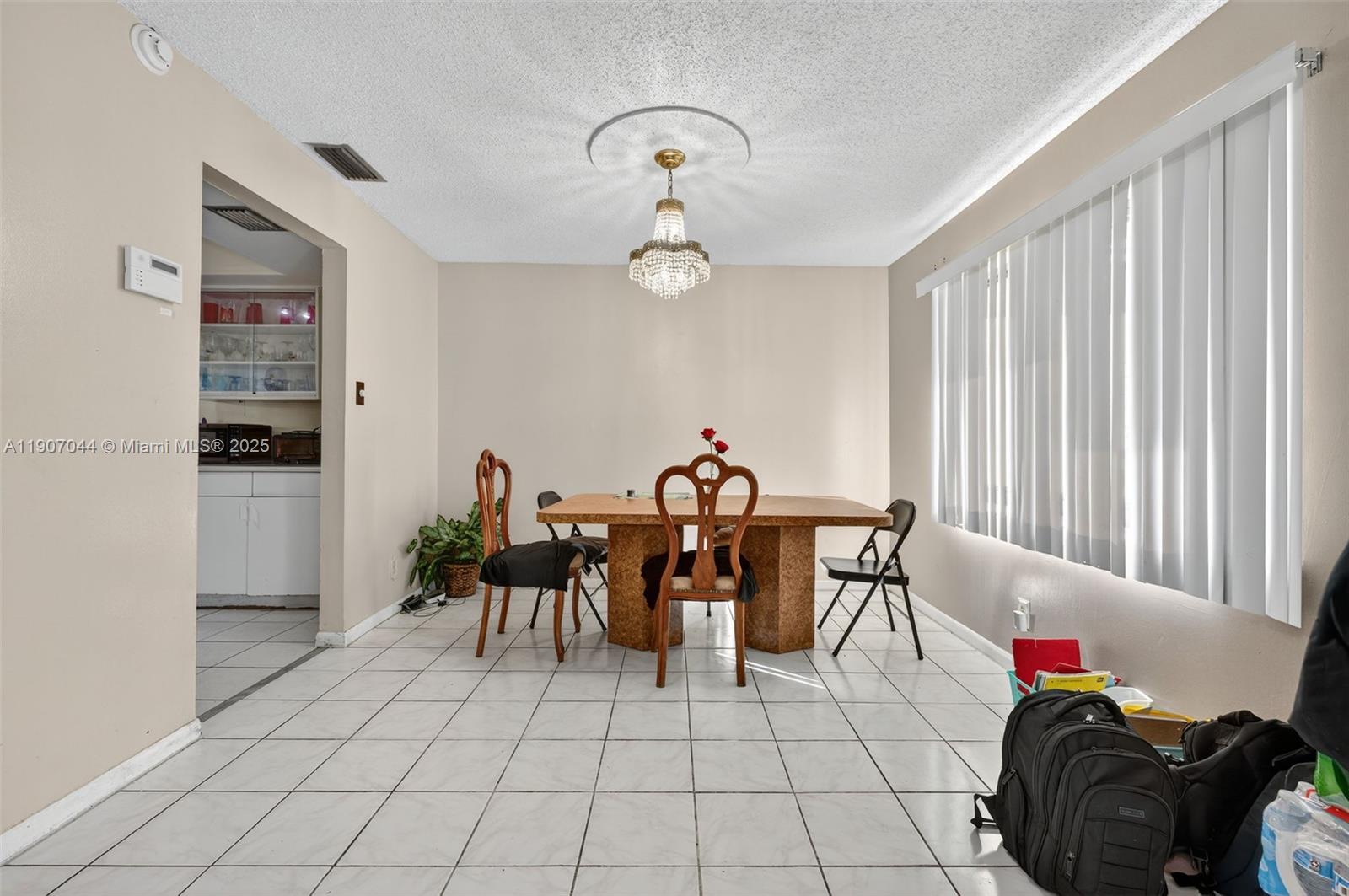 849 Northwest 70th Way Margate, FL 33063 - Photo 8 of 29 a living room with furniture a table and chairs