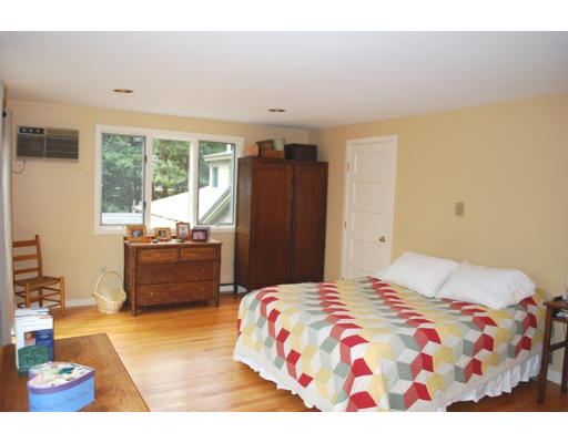 247 Nashoba Road Concord, MA 01742 - Photo 13 of 23 a bedroom with a bed dresser and a window