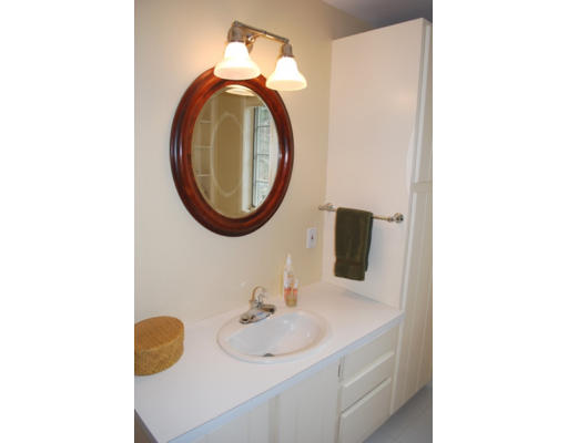 247 Nashoba Road Concord, MA 01742 - Photo 15 of 23 a bathroom with a sink and a mirror