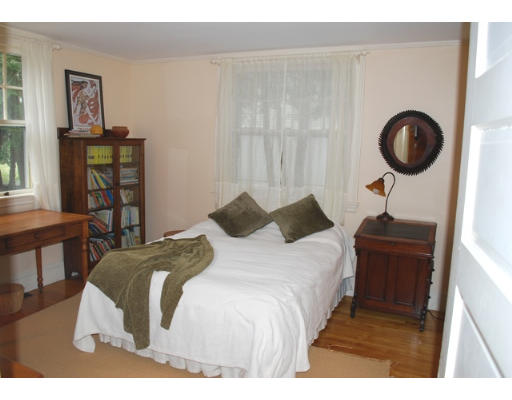 247 Nashoba Road Concord, MA 01742 - Photo 16 of 23 a bedroom with a bed and painting on the wall