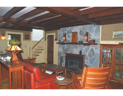247 Nashoba Road Concord, MA 01742 - Photo 3 of 23 a living room with furniture and a fireplace