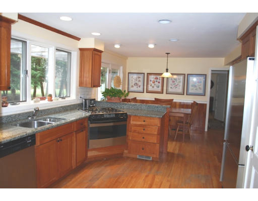 247 Nashoba Road Concord, MA 01742 - Photo 10 of 23 a kitchen with stainless steel appliances kitchen island granite countertop a sink and cabinets