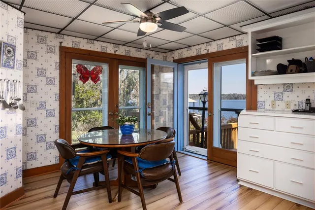 a dining room with furniture and wooden floor