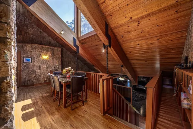 a view of a chairs and table in the balcony
