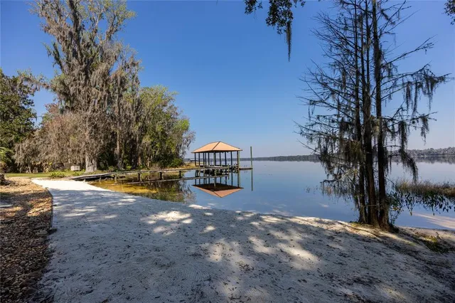 a view of swimming pool with an outdoor space and seating area