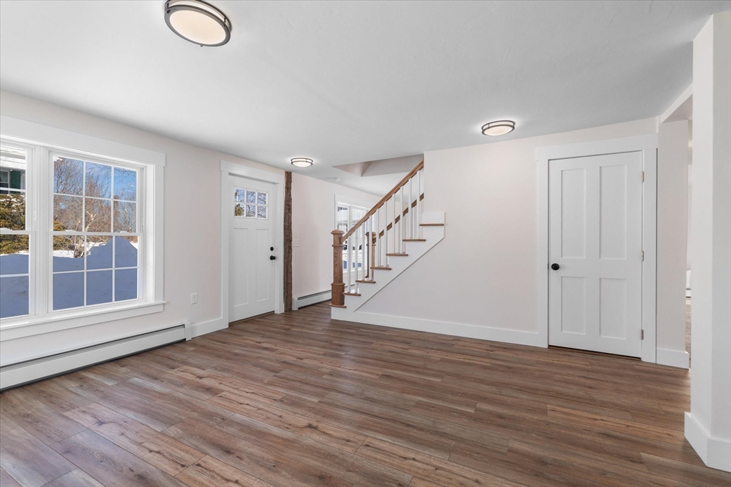 67 Maple Street Oakham, MA 01068 - Photo 15 of 42 wooden floor in an empty room with a window