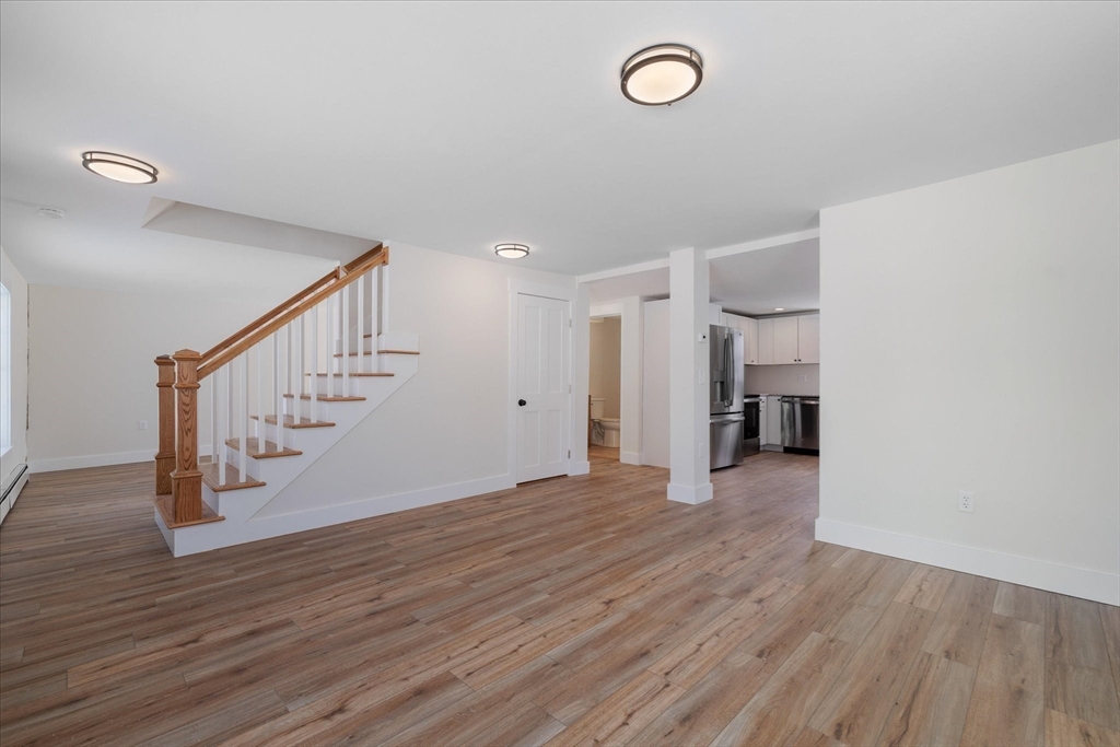 67 Maple Street Oakham, MA 01068 - Photo 16 of 42 a view of empty room with wooden floor