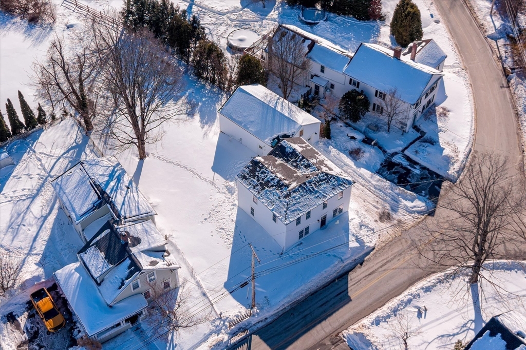 67 Maple Street Oakham, MA 01068 - Photo 7 of 42 an aerial view of a house with a yard