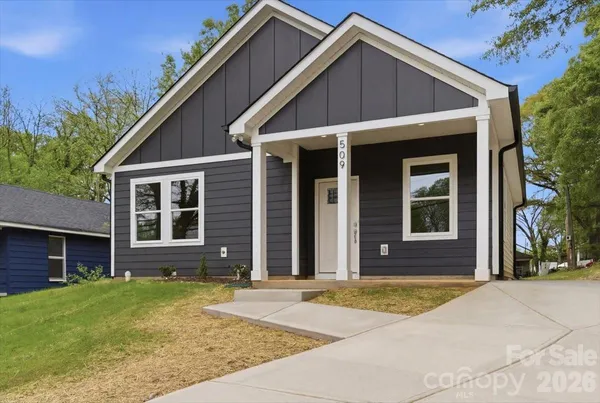 a view of a brick house with many windows