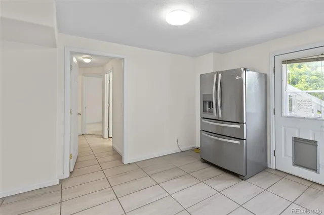 a kitchen with a sink a stove top oven and cabinets