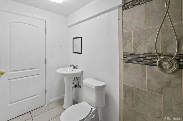 a utility room with cabinets washer and dryer
