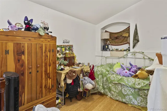 a bedroom with furniture and a bed