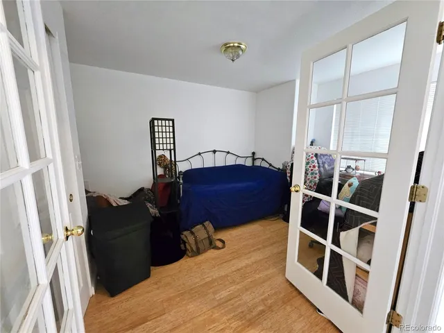 a bed room with a bed and a window