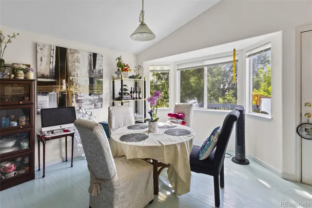 a view of a dining room with furniture window and outside view