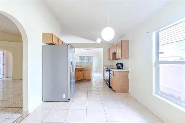 a kitchen that has a sink and a stove