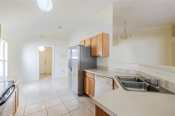 a view of a kitchen with a sink and a window