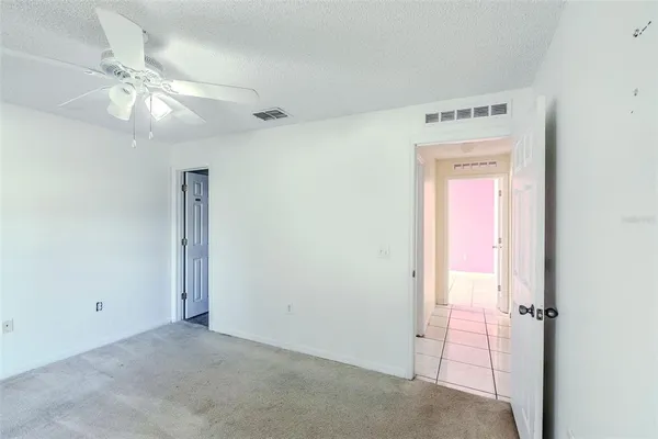 a bathroom with a granite countertop sink toilet a mirror and shower