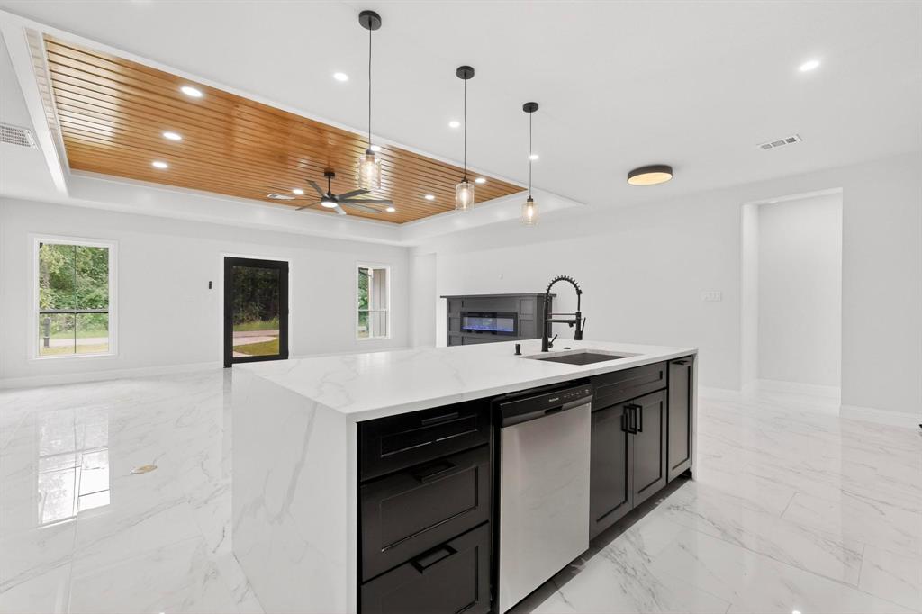 404 Luzon Street Tool, TX 75143 - Photo 14 of 40 a kitchen with a sink a counter space and stainless steel appliances